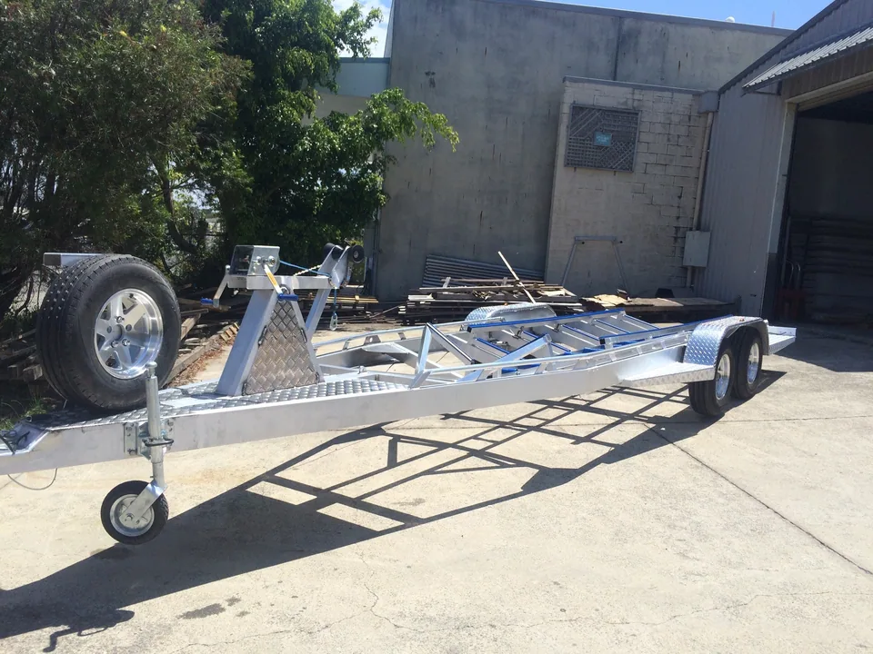 Empty alloy boat trailer with winch post, jockey wheel and spare tyre
